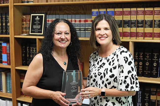 Susan Tuck receiving her CUAA award from Sarah Turner