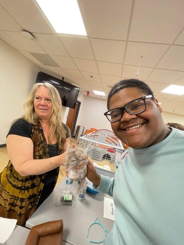 Students from Concord University's Upward Bound Program posing with a gerbil