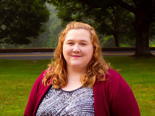 A photo of Katrina Matney standing in front of trees on the Concord University canvas.